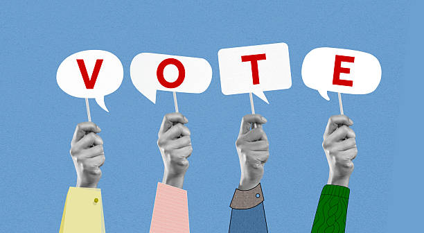 istock Human Hands Holding Letters Word Vote 2221834032