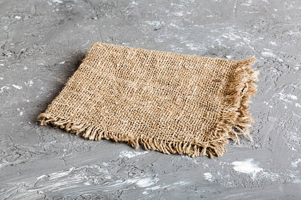 istock Old burlap fabric napkin, sackcloth on table background. top view with copy space 2221834829