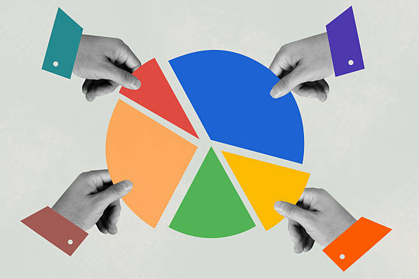 Human hands taking pieces of multi colored pie chart pieces on beige  background