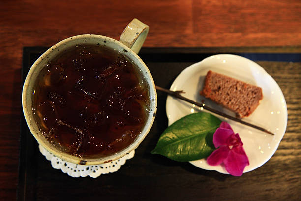 istock cold tea and cookie with flower 2221835130