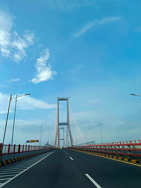 istock The impressive Suramadu Bridge spans under a bright blue sky, with its grand cables stretching upwards. 2221836102