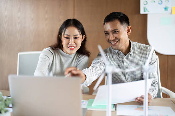 istock Teamwork in Renewable Energy. Professionals engaged in wind energy project planning. 2221838747