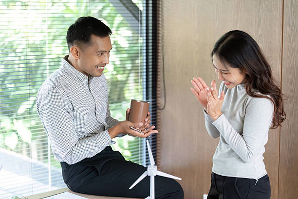 istock Positive Interaction. Team members sharing ideas and enjoying a light moment. 2221838876