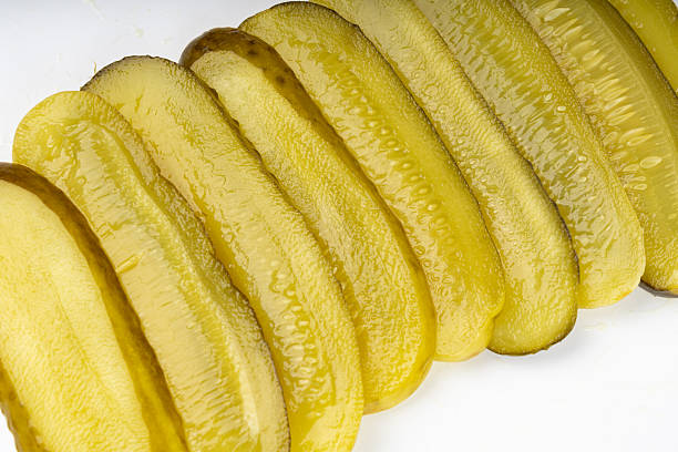 istock Pickled sliced cucumbers, fermented food, marinated canned vegetables, gherkins, pickles 2221839706