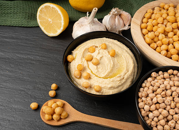 istock Hummus in bowl, houmous dip, chickpea humus tahini sauce, middle eastern spread 2221840216