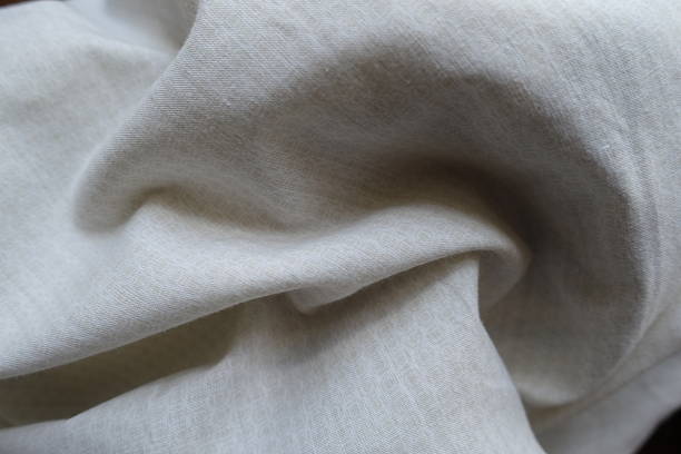 istock pale beige cotton fabric with circles pattern in soft folds 2221840646