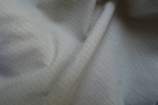 istock Rippled pale beige cotton fabric with circles pattern 2221840650