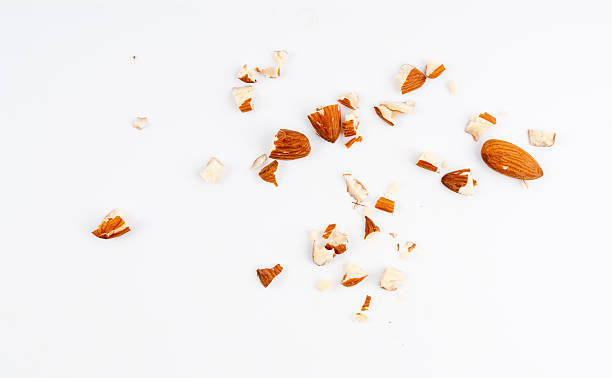 istock Crushed almonds isolated, nut pieces, sliced scattered almond seeds and cut kernels collection on white background 2221840978