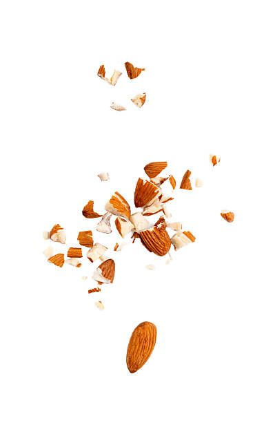 istock Crushed almonds isolated, nut pieces, sliced scattered almond seeds and cut kernels collection on white background 2221841311