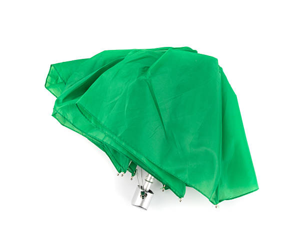 istock Compact folded umbrella isolated, small green parasol, old umbrella 2221841658
