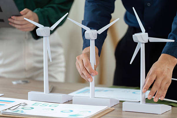 istock ESG Planning Session. Team analyzing renewable energy models and sustainability strategies. 2221841782