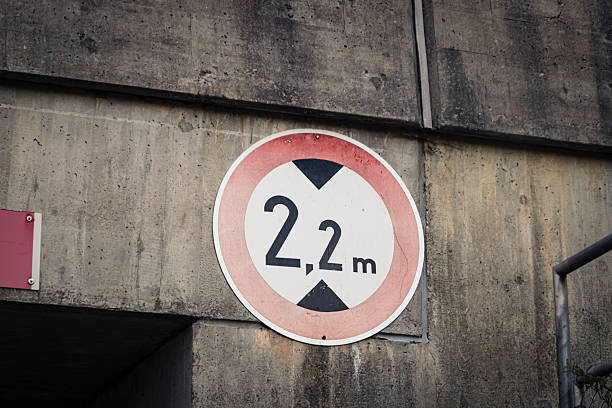 istock traffic sign at underpass indicates maximum height of 2.20 m 2221842608