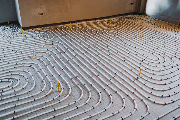 istock White plastic pipes of underfloor heating system are being installed on concrete floor 2221844104