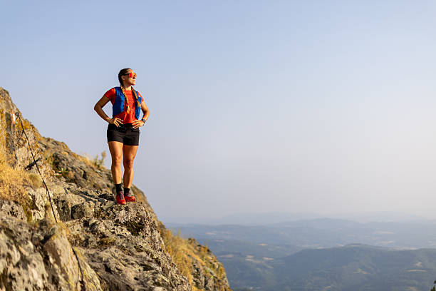 istock Woman taking a break from running in the mountains 2221845621