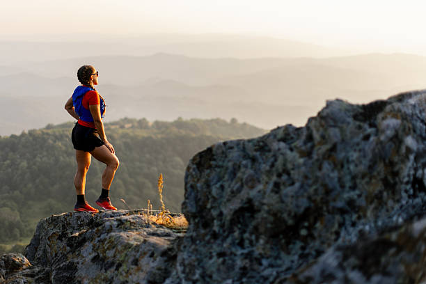 istock Woman taking a break from running in the mountains 2221845656
