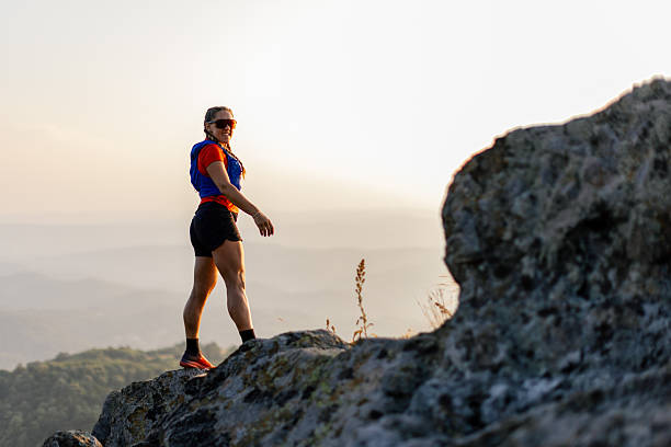istock Woman taking a break from running in the mountains 2221845683