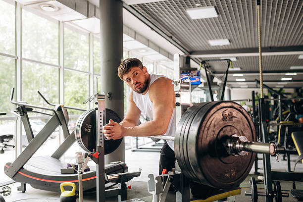 istock Strong man is working out in the gym 2221853005