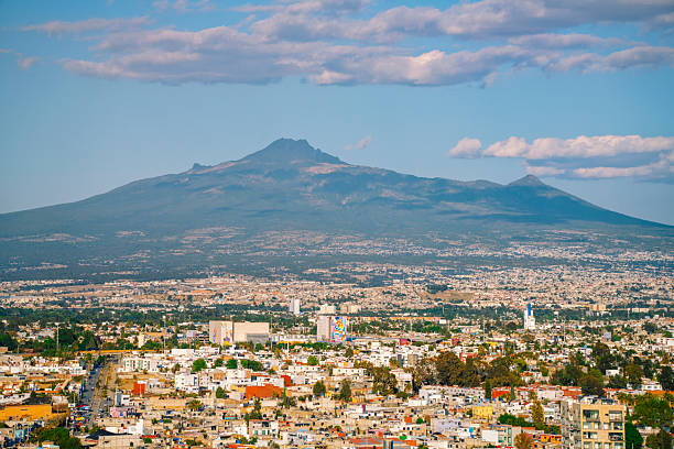 A panoramic view of Cholula, Puebla Mexico with Ixtaccihuatl volcano