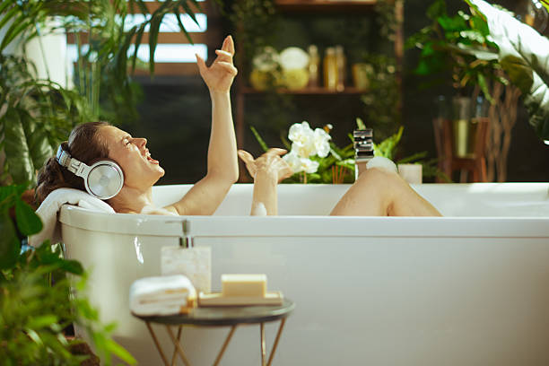 istock Woman Singing Energetically in Luxurious Bath 2221854097
