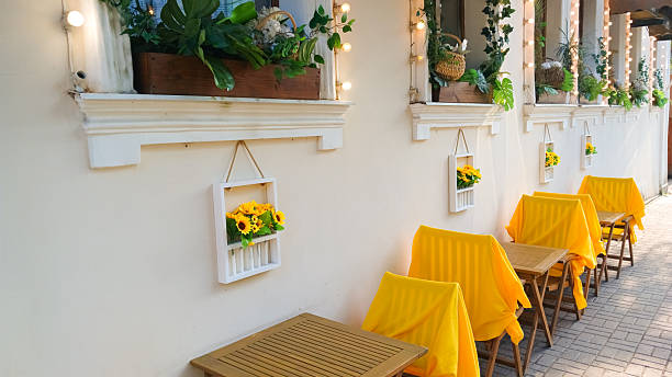 Summer cafe tables with yellow rugs