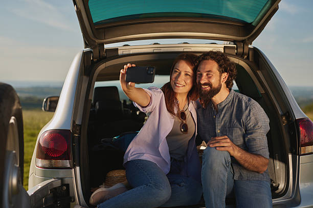 istock Couple taking a selfie during a road trip picnic 2221859507