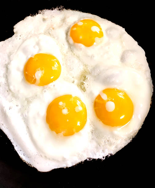 istock Breakfast Of Fried Eggs Cooking On The Stove 2221863881