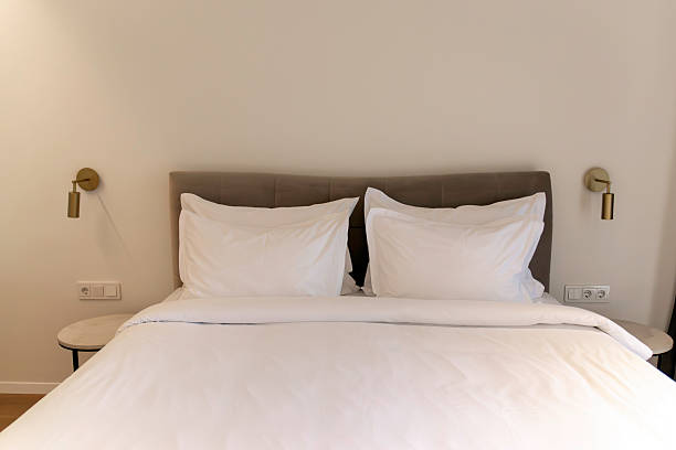 istock Modern Cozy Bedroom with Double Bed and White Linen 2221865128