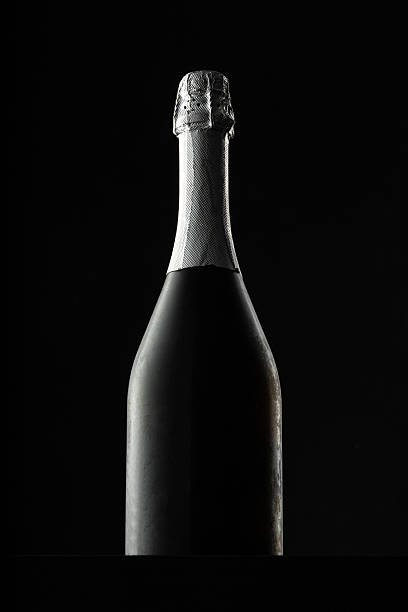 istock Champagne bottle on black background, copy space 2221869476