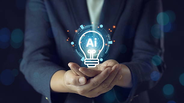 istock Innovation and New Idea Concept with Light Bulb in HandsA pair of hands gently holding a glowing light bulb, representing the birth of a new idea, creativity, and innovation. 2221870889