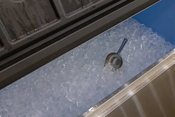 Ice cubes store in ice making machine for clean product. Ice cube maker. Cube ice machine. Suitable for small beverage shops.
