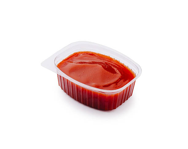 istock Bright red condiment in a small plastic container for savory dishes 2221873727