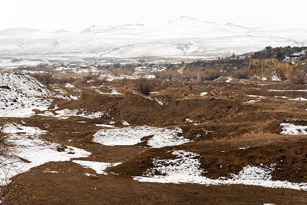 istock Snow-dusted Dry Hill in Winter 2221874652