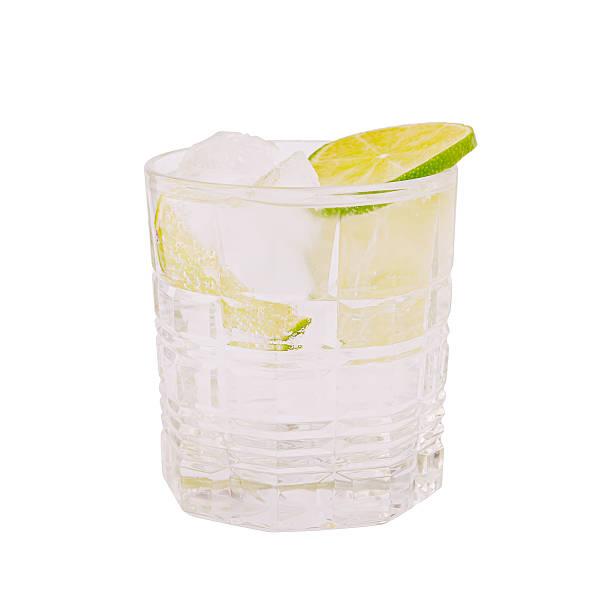 istock Refreshing cocktail with ice and lime garnished in a clear glass 2221875041