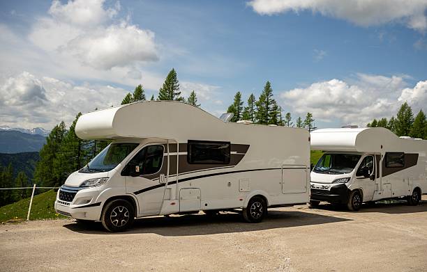 istock Modern camper van parked in alpine nature under blue sky in Austrian Alps 2221875590
