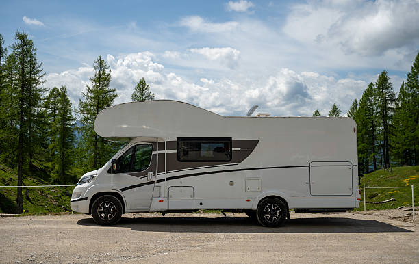 istock Modern camper van parked in alpine nature under blue sky in Austrian Alps 2221875592