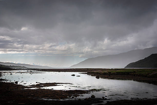 A gloomy, summer landscape HDR image of Little Loch Broom with distant rain approaching, near Ullapool, Ross and Cromarty, Scotland