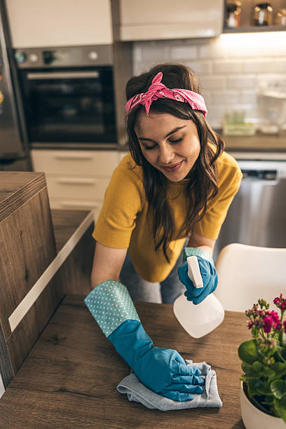 istock Woman Cleaning Kitchen Table 2221879386