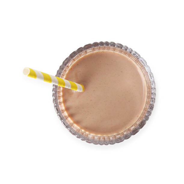 istock Delicious protein shake in glass isolated on white, top view 2221881023