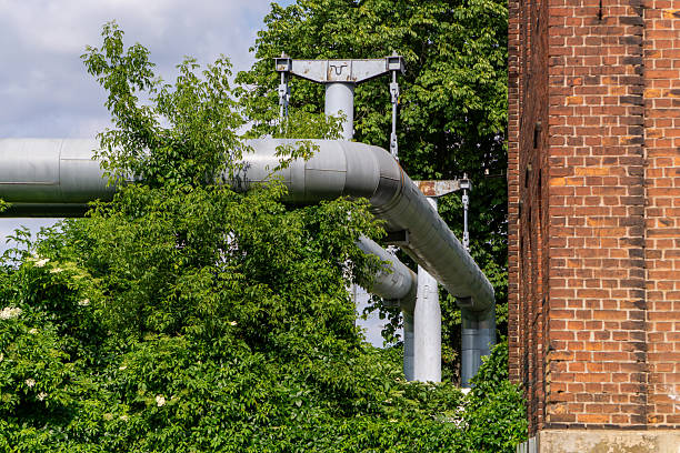 Pipes on the street. Heating pipes in autumn. Heating communications in detail. Details of an industrial facility.