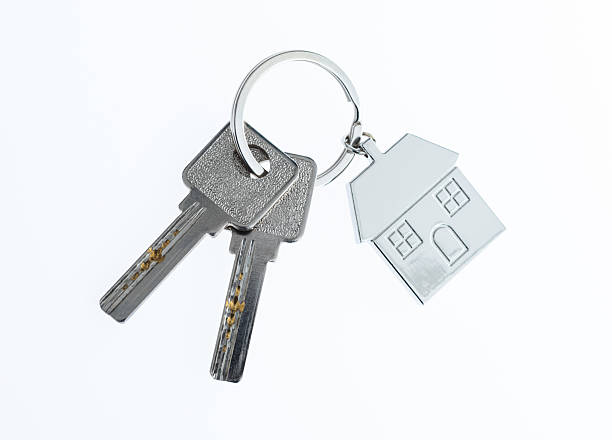 istock House shaped with a key on white background 2221883819