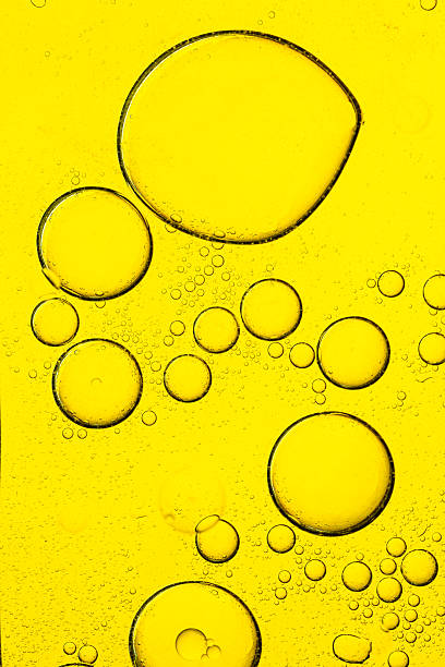 istock Macro yellow bubble texture close up,Macro microscope yellow bubble texture, Close-up Yellow bubbles and drops oil background . golden Yellow water bubbles, close up golden oil drop for celebration 2221884618