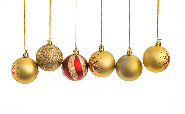 istock Golden Christmas balls hanging in a row 2221884652