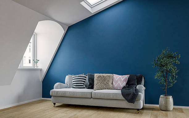istock Bright Scandinavian Loft Interior with Roof windows (skylight), sloped ceiling, Cozy Sofa and Decorative Cushions 2221888236