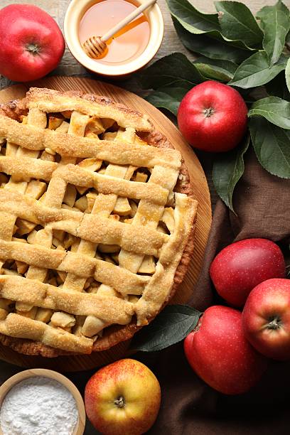 istock Flat lay composition with tasty homemade apple pie and ingredients on table 2221889930