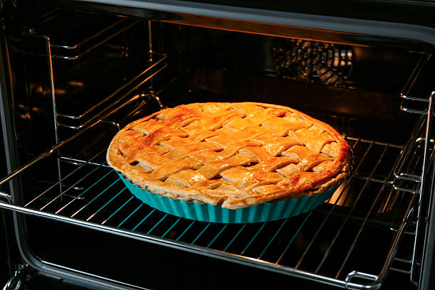 Baking dish with homemade apple pie in oven