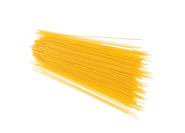 istock Raw spaghetti isolated, dry spagetti, long wheat noodles, uncooked italian macaroni bundle 2221894082