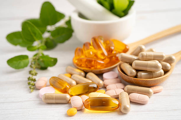 istock Alternative medicine herbal organic capsule drug herb. 2221898677