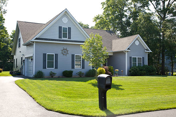 Front yard and suburban home with manicured lawn in the suburbs.