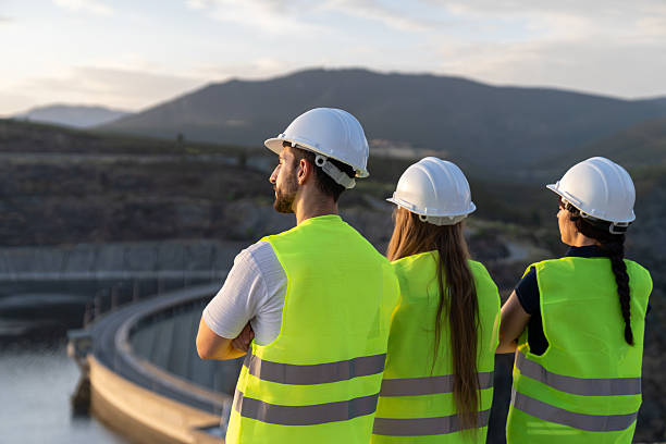 istock Engineers inspecting a hydroelectric power plant dam at sunset 2221908587