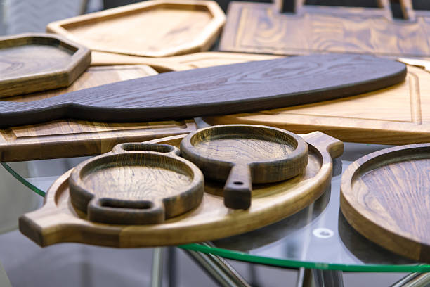 istock Wooden kitchenware displayed on a glass table at a craft fair 2221908856